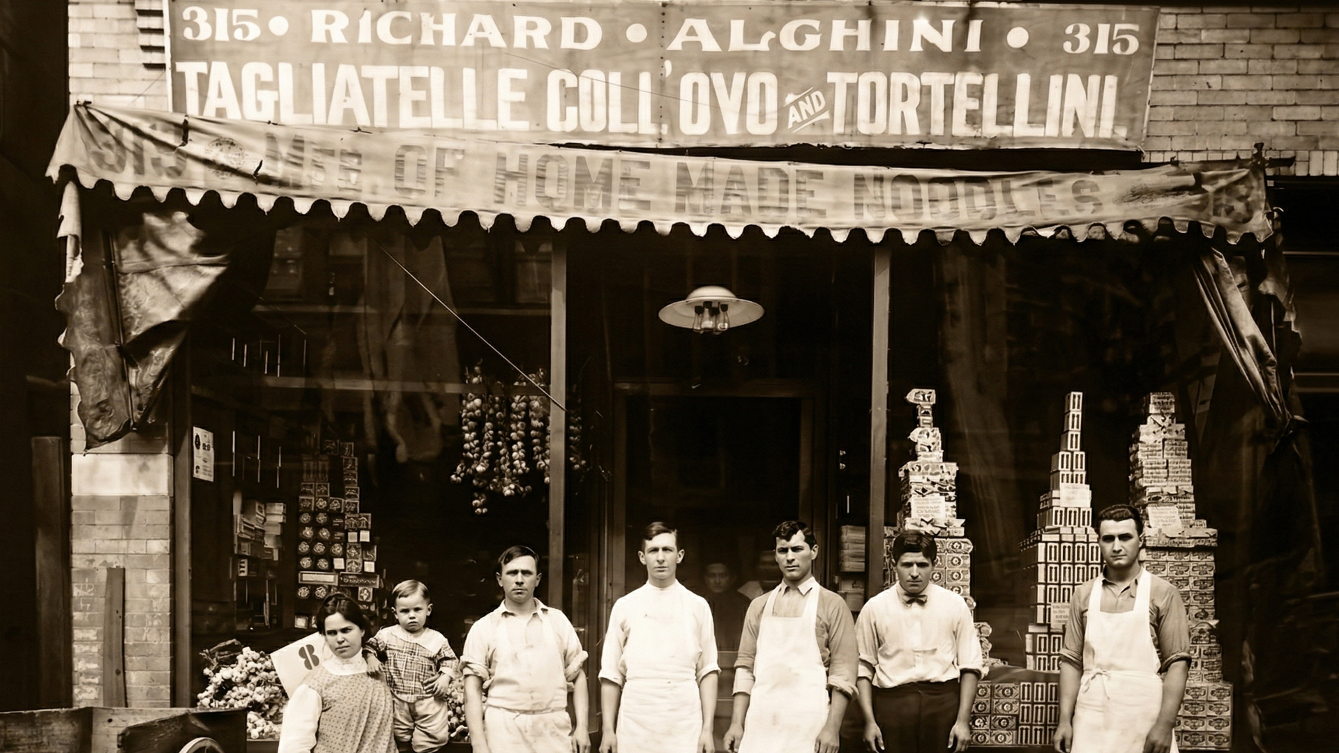 Richard Alghini's store at 315 — the Alghini family and staff pose outside their tagliatelle and tortellini shop, early twentieth century